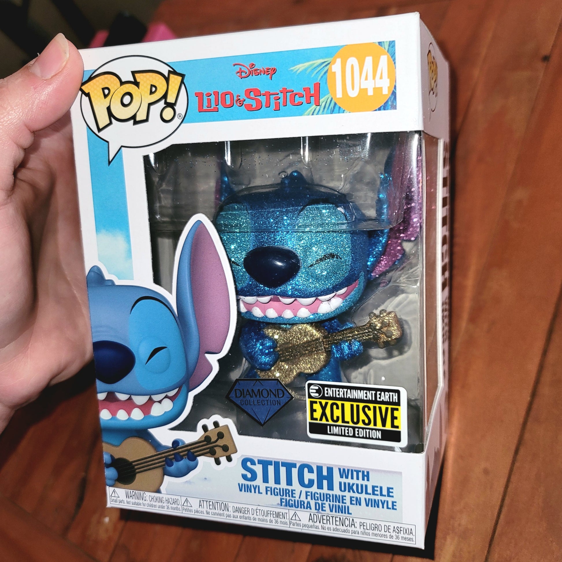 Funko POP!: Lilo & Stitch - EE Excl Stitch with Ukulele (1044) Diamond  Glitter 3.75 Inch Funko POP! sold by Stronghold Collectibles